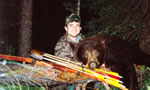 Here is a very nice Black Bear and a hunter we are trying to identify